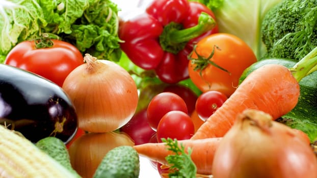 Closeup photo of big assortment of fresh ripe vegetable on reflective surface