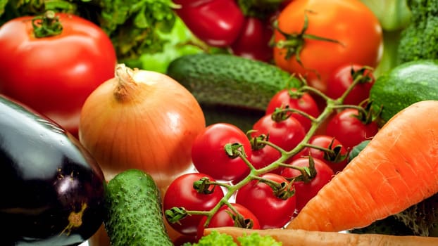 Closeup photo of onions, cucumber, carrot, bell pepper, eggplant and salad leaves