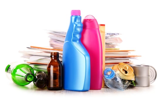 Recyclable garbage consisting of glass, plastic, metal and paper isolated on white background