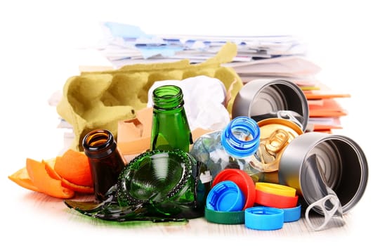 Recyclable garbage consisting of glass, plastic, metal and paper isolated on white background