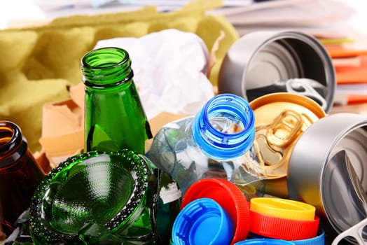 Recyclable garbage consisting of glass, plastic, metal and paper isolated on white background