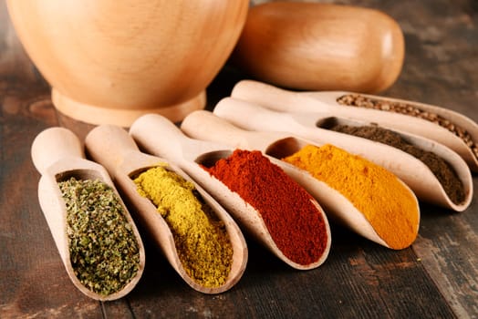 Variety of spices on kitchen table.