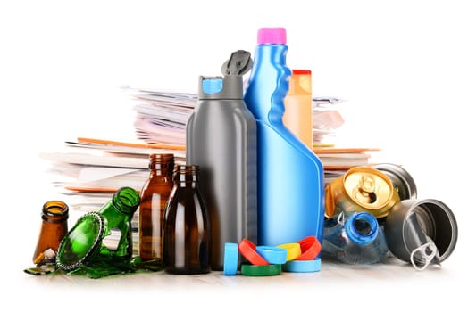 Recyclable garbage consisting of glass, plastic, metal and paper isolated on white background