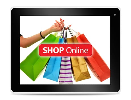 Paper shopping bags on computer tablet screen. Shopping online. E-commerce