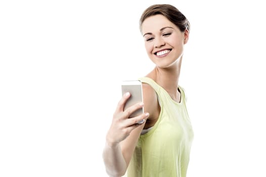 Happy woman taking a picture of herself