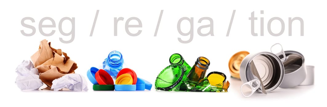 Recyclable garbage consisting of glass, plastic, metal and paper isolated on white background