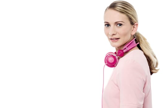 Side pose of pretty woman with head phones