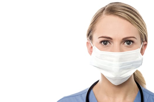 Smiling female doctor with surgical mask
