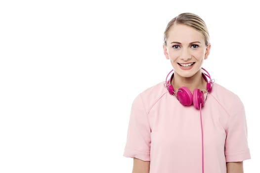 Pretty girl with head phones around her neck