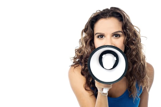 Young female proclaiming into the loudspeaker