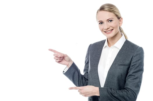Female executive pointing something at copyspace