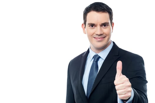 Middle aged businessman showing thumbs up gesture