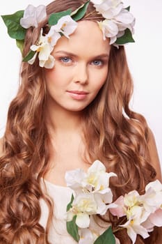 Charming female with luxurious curly hair looking at camera