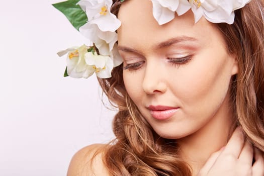 Young woman in floral wreath