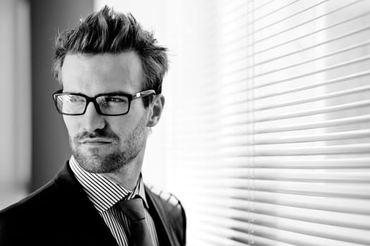 Young handsome businessman in eyeglasses
