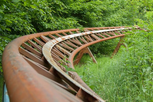 Rusted track of a roller coaster out of service