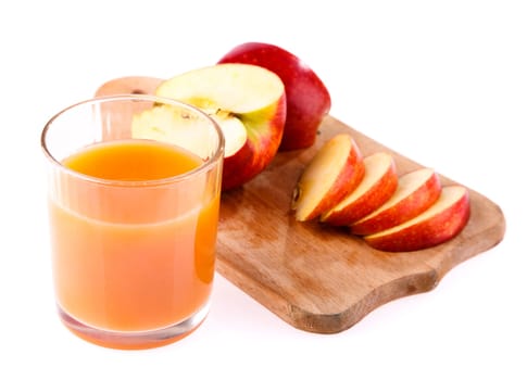 glass of juice and apple and cut into the board on a white background