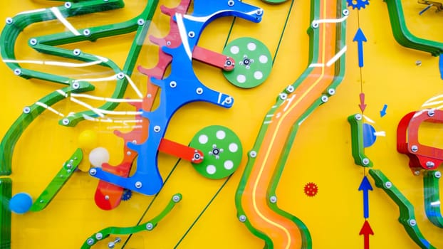 Abstract image of colorful mechanism for children education on playground.