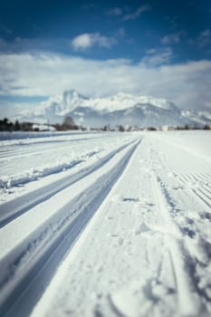 Cross-country skiing slope in Austria, beautiful mountain scenery, blurry background
