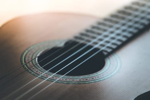 Cutout of a classical guitar corpus and strings, closeup