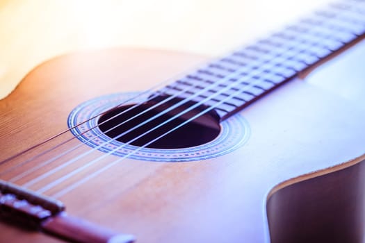 Cutout of a classical guitar corpus and strings, closeup