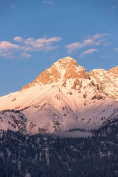 Idyllic scenery with snowy mountains in the evening sun, Alps, Austria