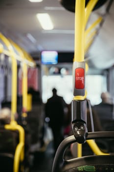 Stop Button in a bus, public transport, blurry