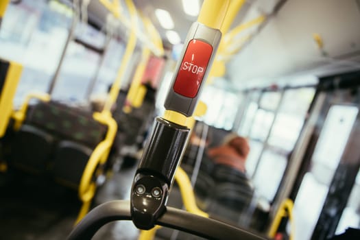 Stop Button in a bus, public transport, blurry