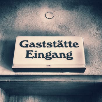 old German door sign of a restaurant of the 60s