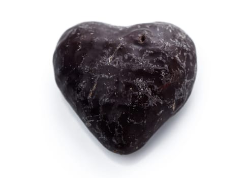 A charming heart-shaped chocolate sits elegantly on a pristine white background, embodying love and sweetness.