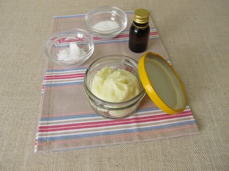 Homemade deodorant in a glass with coconut oil, baking soda and essential oil