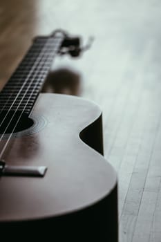 Cutout of a classical guitar corpus and strings, closeup