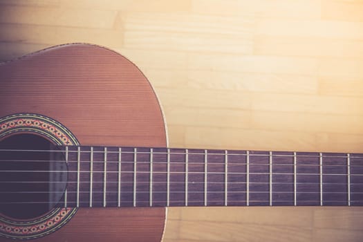 Cutout of a classical guitar corpus and strings, closeup