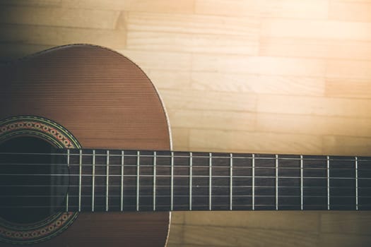 Cutout of a classical guitar corpus and strings, closeup