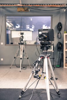 Film camera on a tripod in a television broadcasting studio