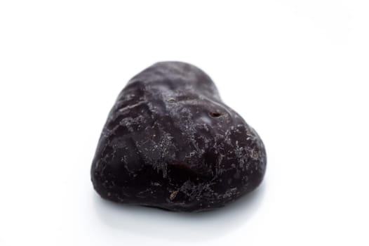 A heart-shaped stone showcasing intricate textures sits gracefully against a clean backdrop, inviting admiration.