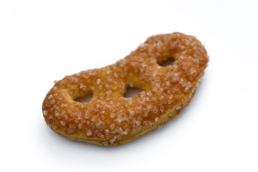 Glazed pretzel with sparkling sugar crystals sits invitingly on a clear background, ready to be enjoyed.