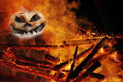 A creepy pumpkin head in the fire. A pumpkin head in the flames