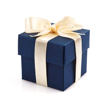 dark blue gift box with golden ribbon and bow isolated on white