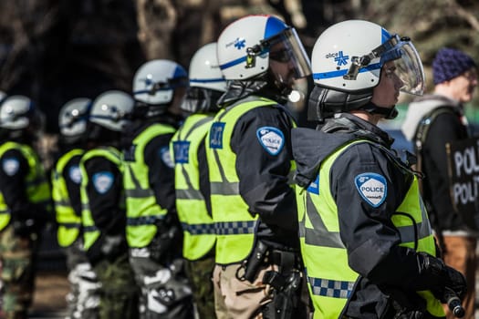 MONTREAL, CANADA, APRIL 02 2015. Riot in the Montreal Streets to counter the Economic Austerity Measures. Closeup of Police Gear and Protections
