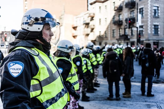 MONTREAL, CANADA, APRIL 02 2015. Riot in the Montreal Streets to counter the Economic Austerity Measures. Cops making a line to Control the Protesters