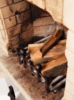 vintage antique fireplace with dry firewood