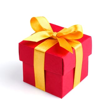 red gift box with golden ribbon and bow isolated on white