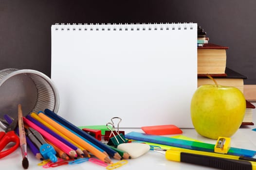 Notebook with school stationary objects supplies, copyspace