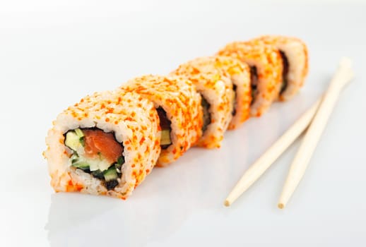 Traditional japanese sushi and chopsticks isolated on white background