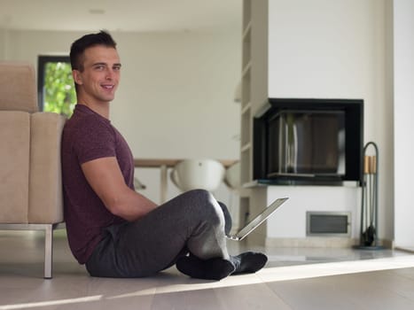 Real man Using laptop on the floor At Home  Enjoying Relaxing