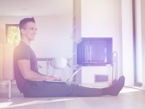 Real man Using laptop on the floor At Home  Enjoying Relaxing