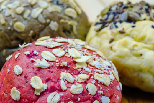 Homemade veggie burger whole wheat buns bread of beetroot, greentea and pumpkin with cereal and with sesame seeds