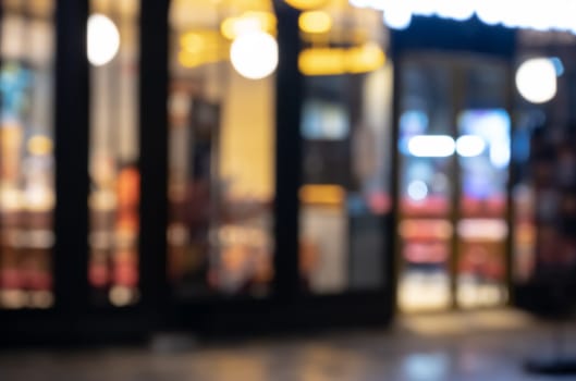 Abstract blur and defocused coffee shop and restaurant with coloful bokeh night lights for background