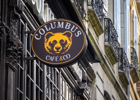 BAYONNE, FRANCE - CIRCA APRIL 2021: Columbus Cafe and Co sign. Olumbus Cafe is a a French coffe shop chain.